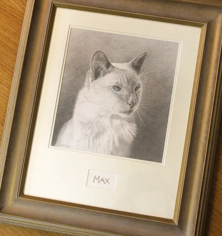 Pet ashes being carefully incorporated into memorial portrait artwork