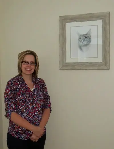 A detailed image of a pet portrait in progress or freshly completed, awaiting framing and hanging in its new home.